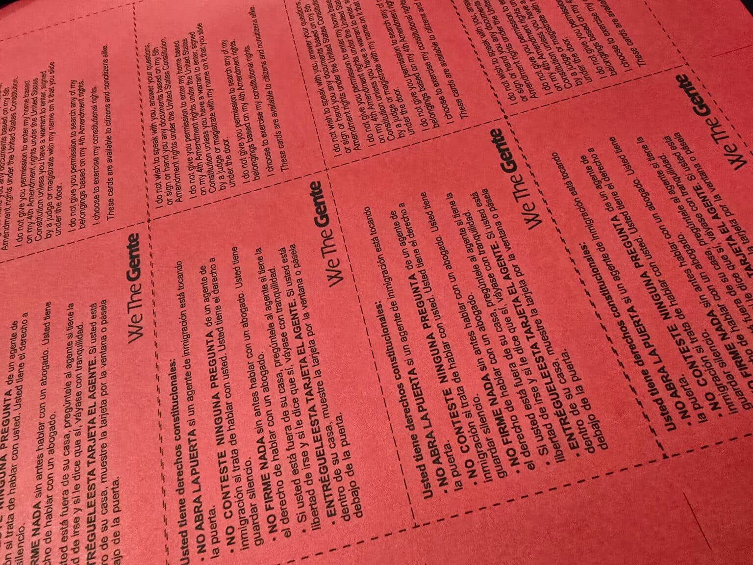 We The Gente® Red Cards (Tarjetas Rojas) printed on red cardstock, ready to be distributed to the community.